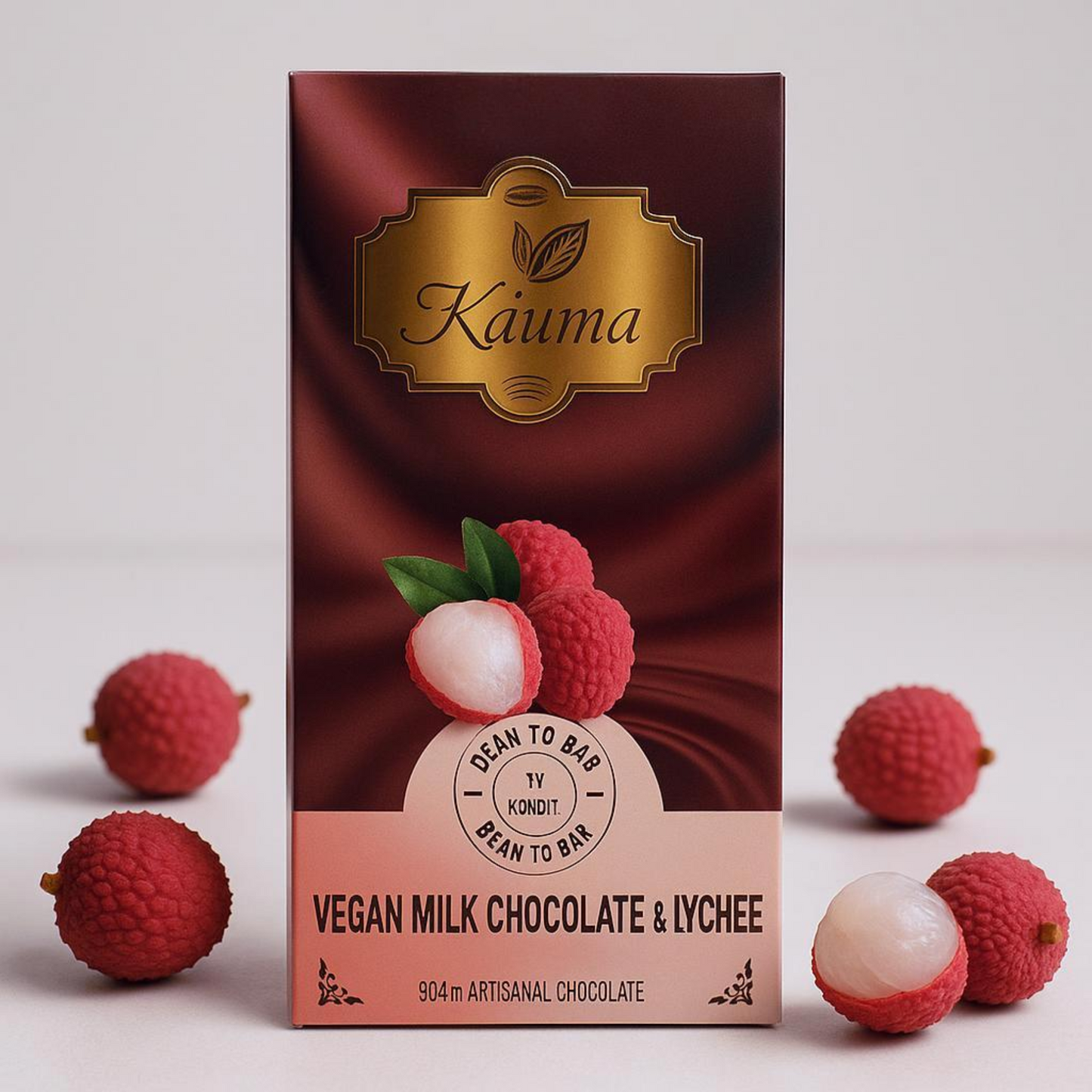 kauma vegan milk chocolate and lychee packaging with lychees on a white background
