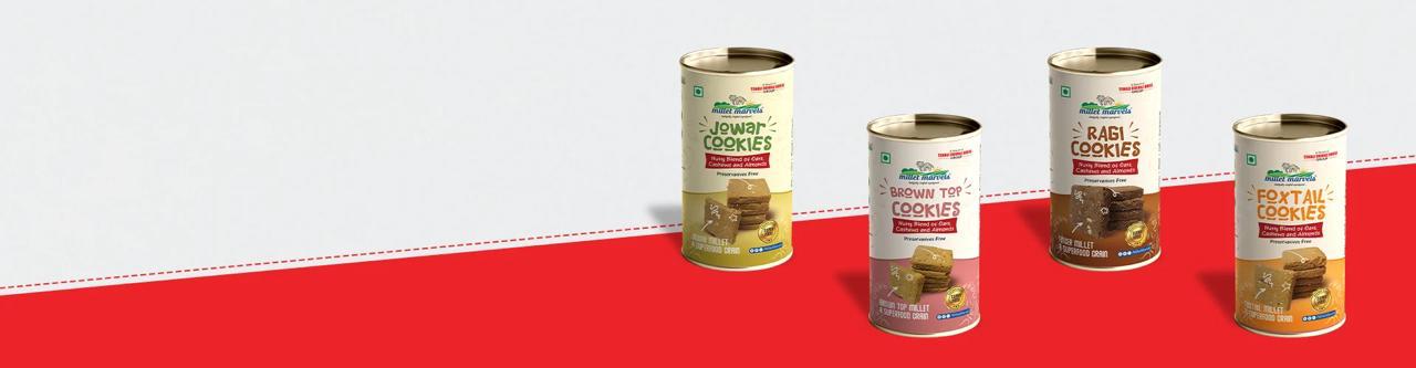Five cans of 'Brown Rice' on a red and white background