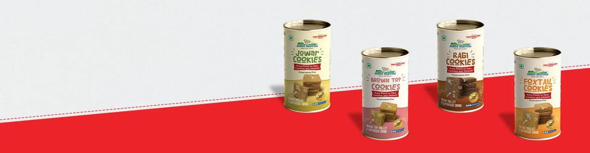 Five cans of 'Brown Rice' on a red and white background