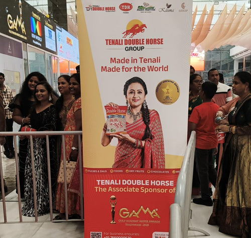 Promotional banner for Tenali Double Horse in a shopping mall setting