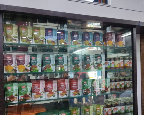 Vending machine stocked with various food items and drinks