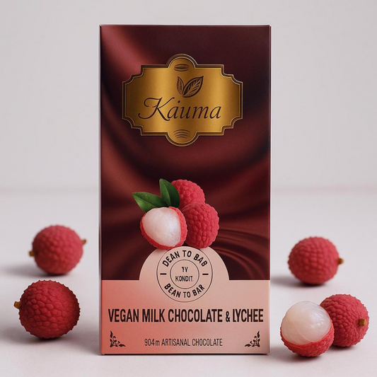kauma vegan milk chocolate and lychee packaging with lychees on a white background