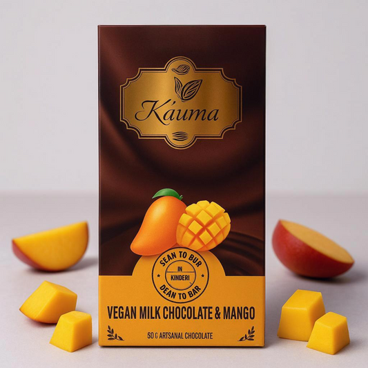 Vegan milk chocolate and mango packaging with Kauma branding on a light gray background.