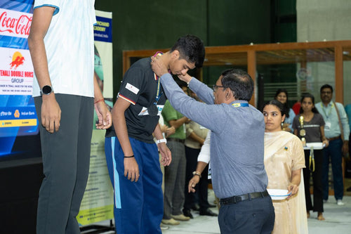 Person receiving an award.